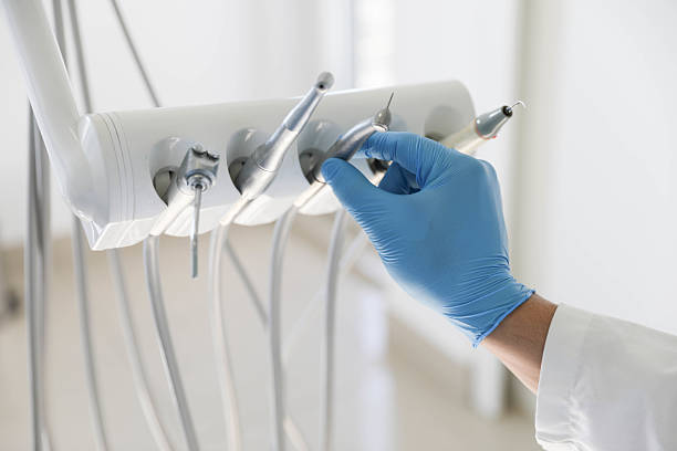Professional Root Canal Treatment technician working in Village Green, NY